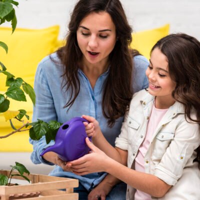 mother-daughter-watering-plant mother-daughter-watering-plant